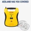 Yellow Defibtech Lifeline AED Trainer with training pads and AEDLand slogan